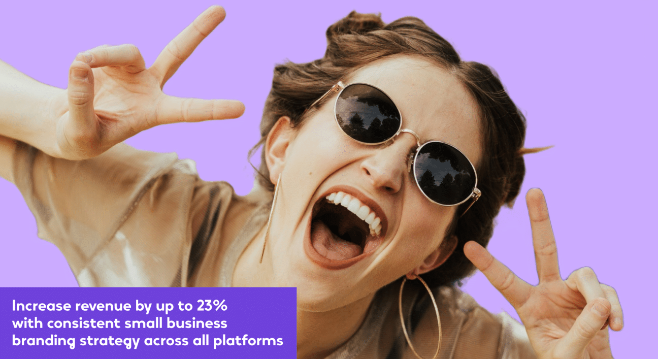 The image is a fun and energetic promotional graphic. It features a young woman with round sunglasses, making a "peace" sign with one hand and a "rock on" gesture with the other, exuding a vibe of cool confidence and joy. Her mouth is open in what appears to be a shout or laugh, and her expression conveys excitement and vitality. The background is a solid, vibrant purple, creating a bold contrast that adds to the lively atmosphere of the image. Below her is a block of text in white on a purple background that reads, "Increase revenue by up to 23% with consistent small business branding strategy across all platforms."
